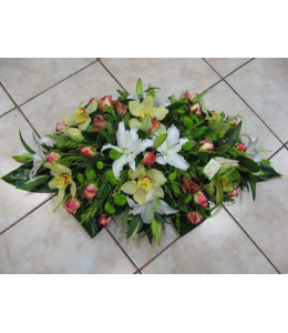 Table composition with oriental alstroemerias and sympitium orchids