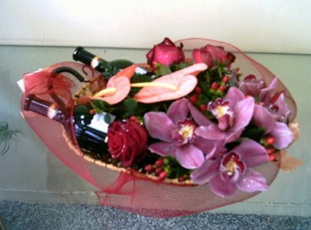 Flower arrangement with various wines