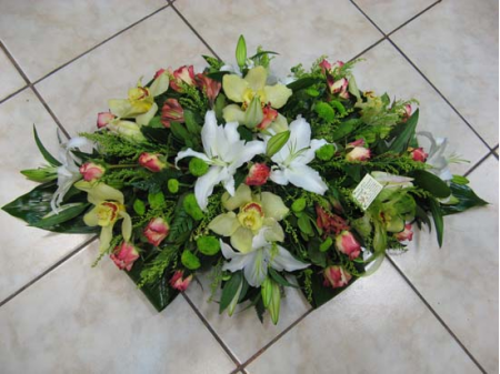 Table composition with oriental alstroemerias and sympitium orchids