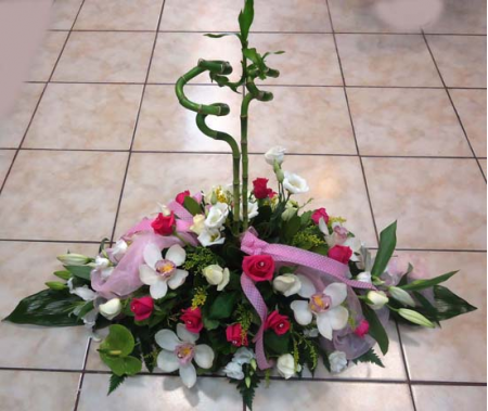 Construction for a reception with Sympitium lisianthus and bamboo orchids