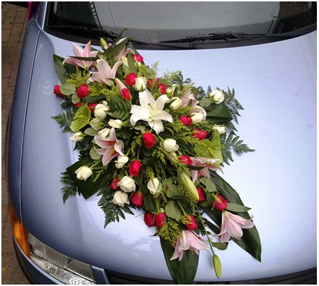 Decoration of the Wedding Car with Red Roses