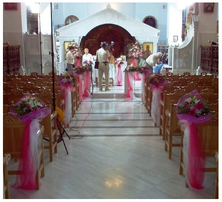 Wedding Decoration of the Church's Interior Aisle in White and Pink Tints